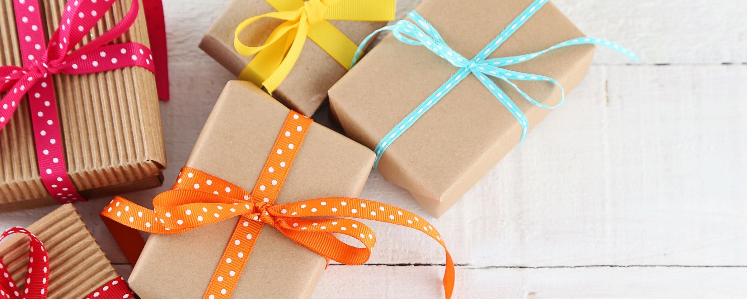 Gifts for Every Occasion banner featuring an assortment of wrapped gifts