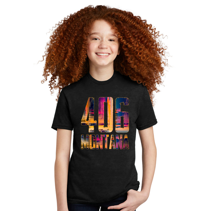 A young lady wearing a black tshirt with a vivid 406 Montana design