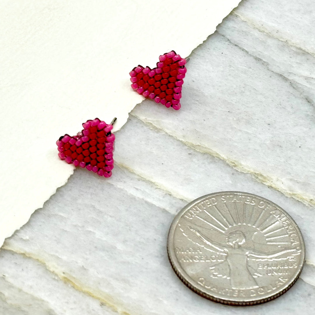 Pair of Heart Beaded Earrings with Stainless Steel Studs, handmade in Montana USA by Aurum Shimmer (red and pink), with scale