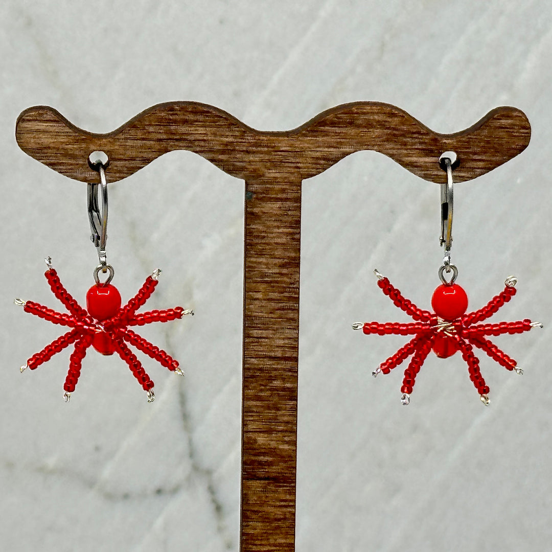 Pair of red Spider Beaded Earrings with Stainless Steel Lever Backs, handmade in Montana USA by Aurum Shimmer, hanging