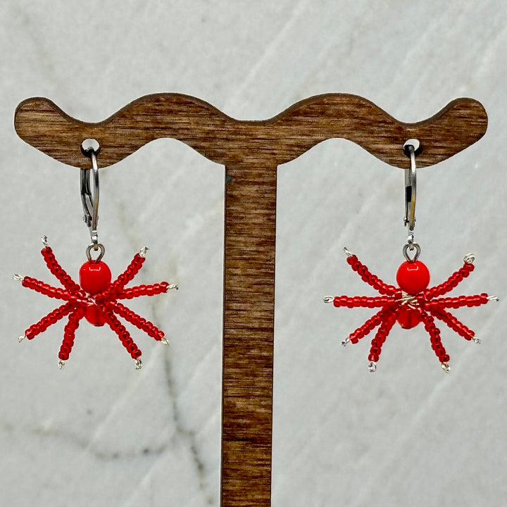 Pair of red Spider Beaded Earrings with Stainless Steel Lever Backs, handmade in Montana USA by Aurum Shimmer, hanging