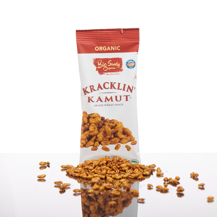 1.4 oz. bag of Churro flavored Kracklin Kamut wheat germ snack made with khorasan wheat grown in Montana by Big Sandy Organics, front with displayed product