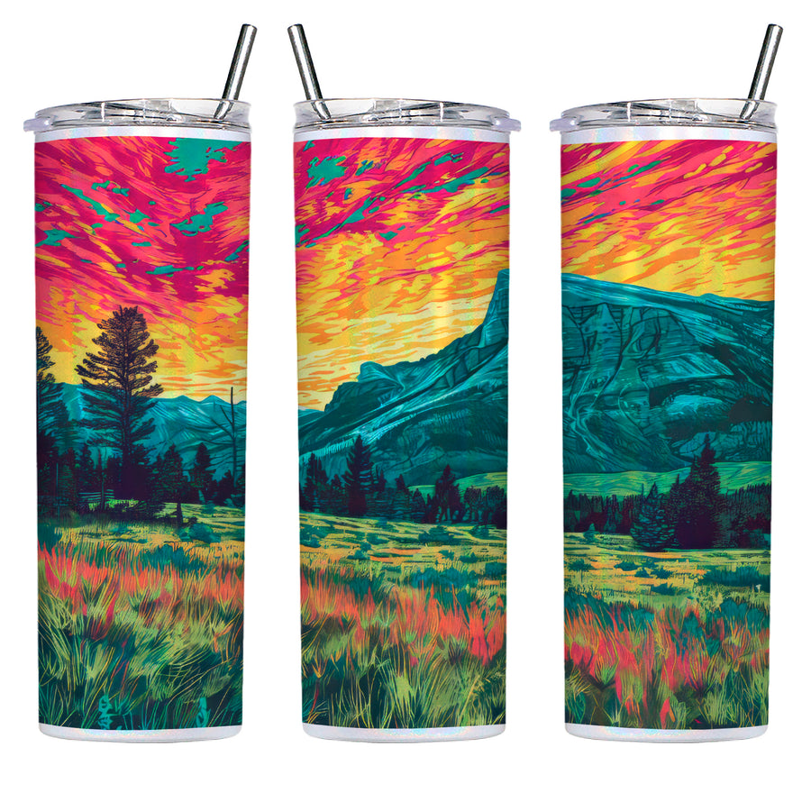 This 20oz shimmer tumbler with a metal straw is shown from three angles printed with a vibrant piece of art by Blue Peak Creative in Montana, USA. The art is a stunning sunset over a mountain and a field dotted with  wildflowers.