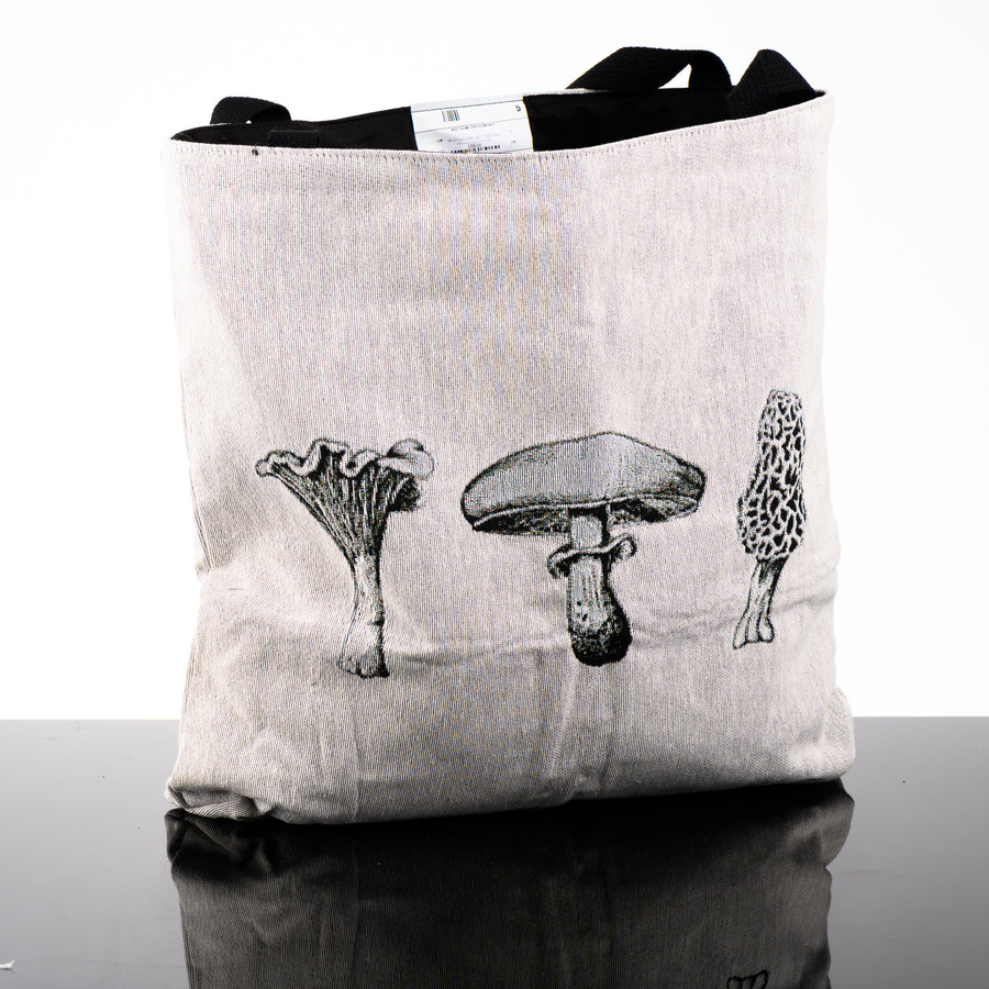 Mushroom Woven Tote Bag featuring a black and white design by Montana artist Brittany Finch (an assortment of mushroom drawings) woven into the bag; made in USA