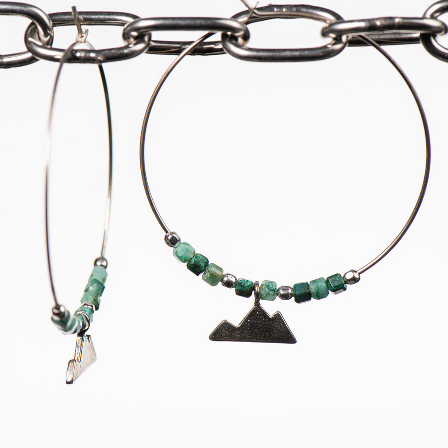 Cobblestone Design of Montana's Hoop Earrings, handcrafted earrings made in Montana, featuring a sterling silver mountain dangle and chrysocolla beads