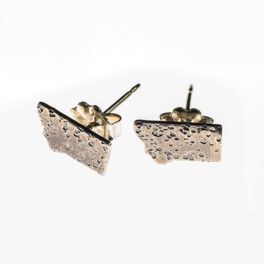 Cobblestone Designs of Montana's Montana Stud Earrings - lightly hammered sterling silver stud earrings in the shape of Montana, made in Montana