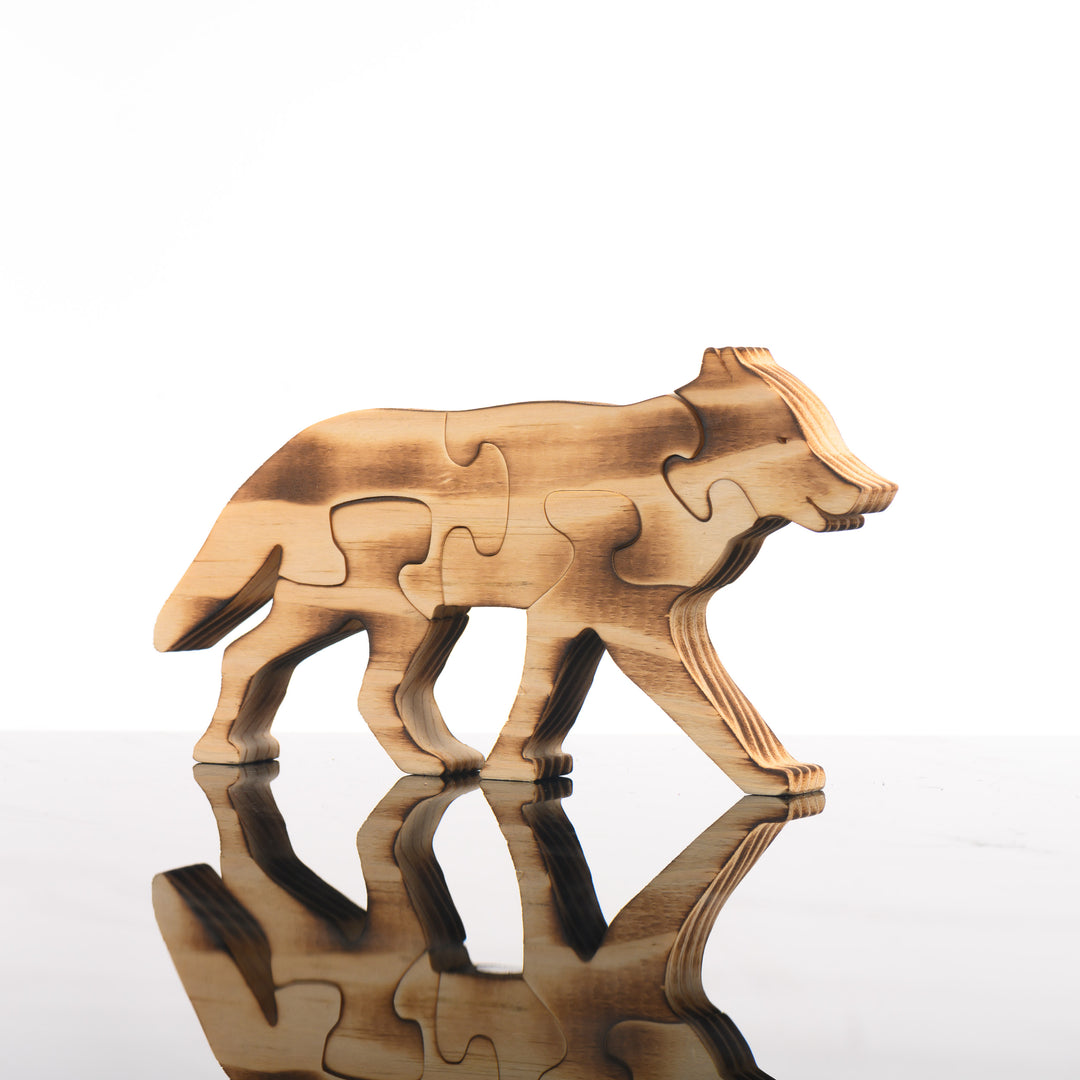 This handmade wooden five piece puzzle is in the shape of a wolf.