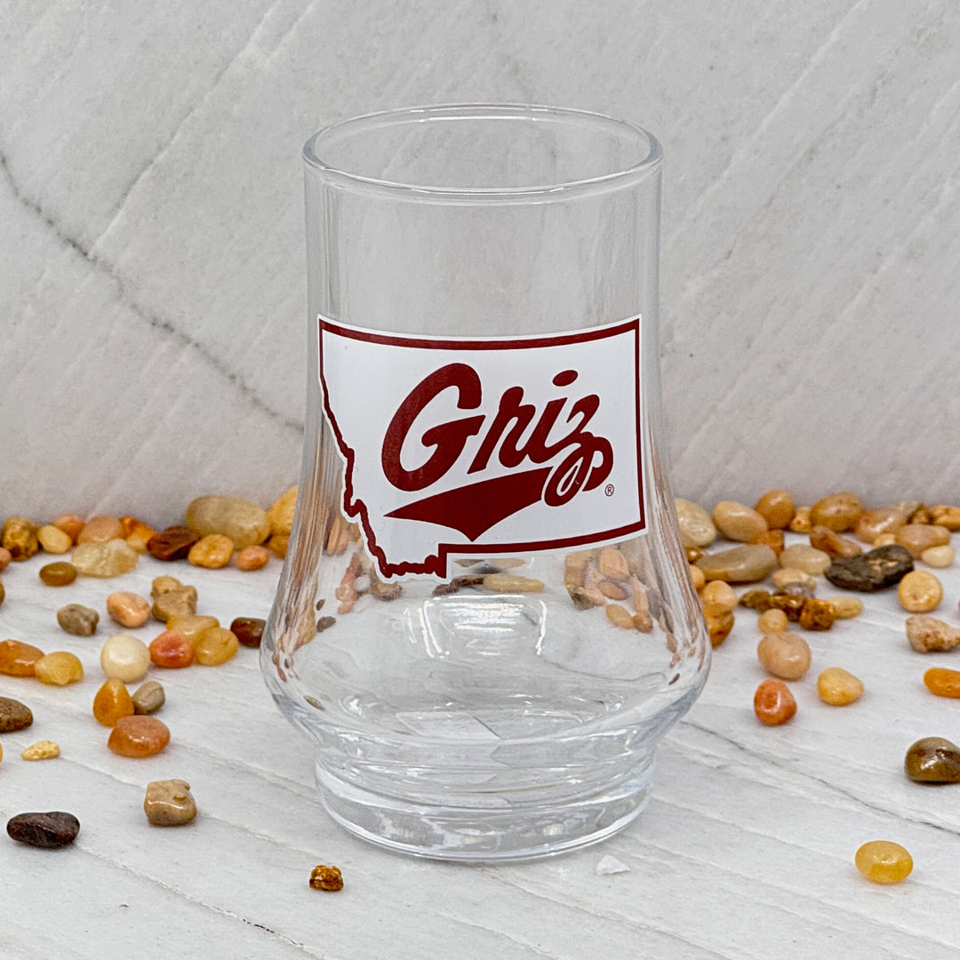 Blue Peak Creative's Montana Grizzlies Glen Cairn Whiskey Glass - Glen Cairn Whiskey Glasses decorated with University of Montana Griz Script over Montana, front