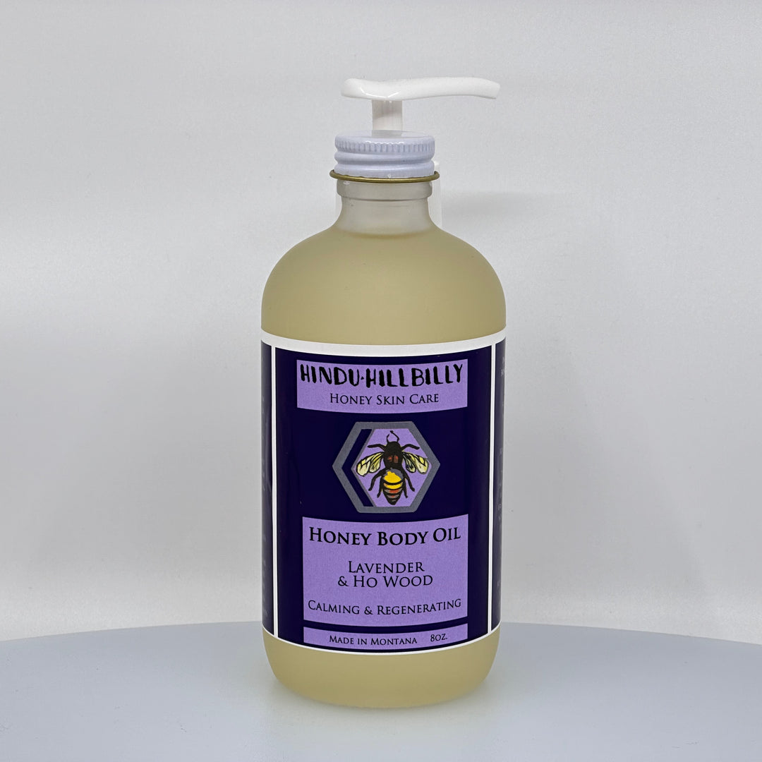 8 oz. bottle of Hindu Hillbilly's Lavender & Ho Wood Honey Body Oil, front