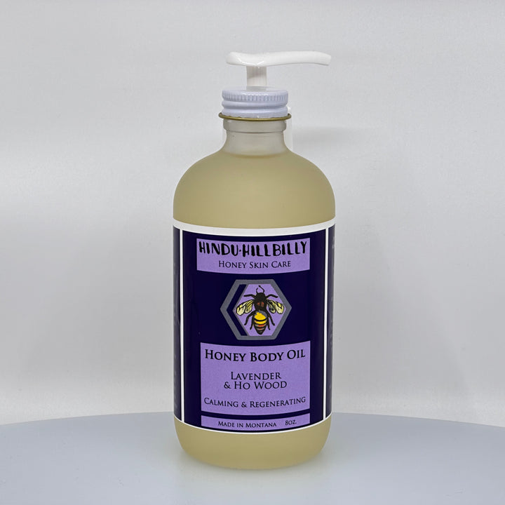 8 oz. bottle of Hindu Hillbilly's Lavender & Ho Wood Honey Body Oil, front