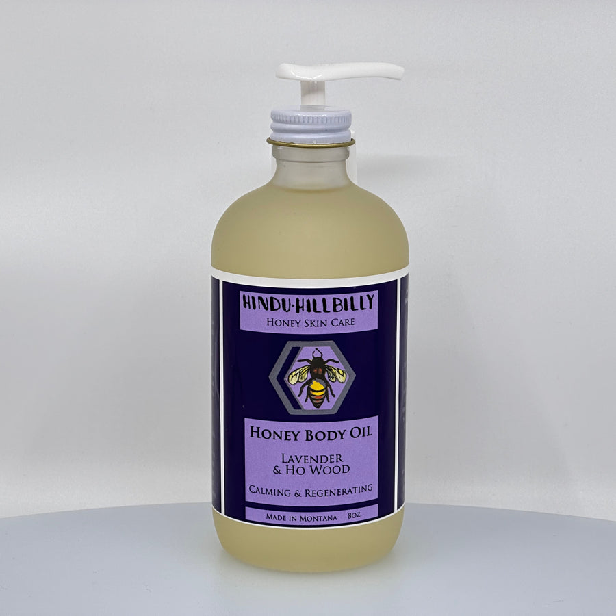 8 oz. bottle of Hindu Hillbilly's Lavender & Ho Wood Honey Body Oil, front