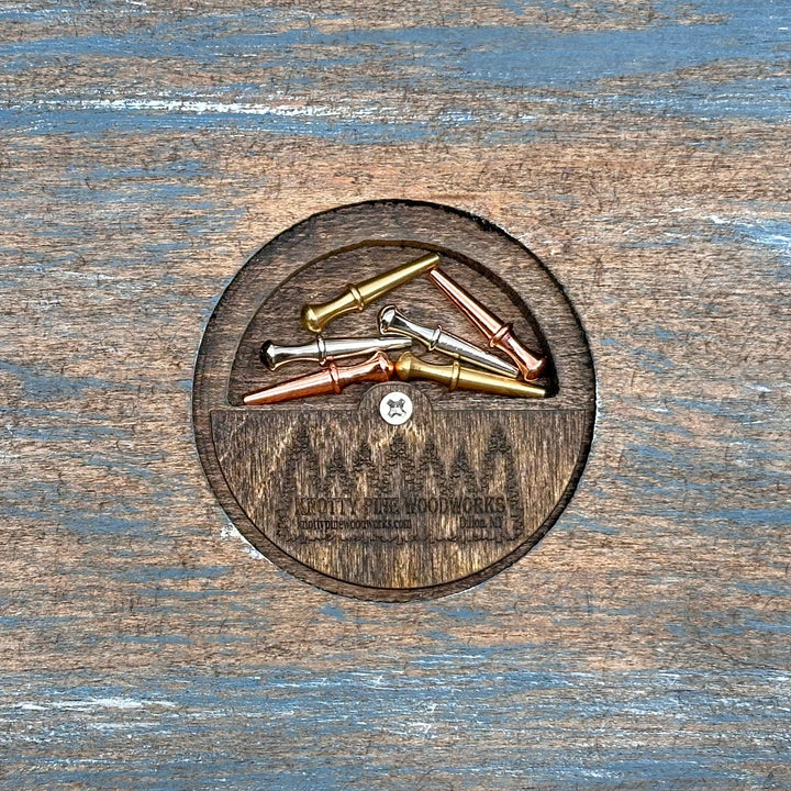 Knotty Pine Woodworks Handmade Camper Cribbage Board Lakeside (back)—this handmade wooden cribbage board is the perfect Montana-made gift for game lovers and adventurers . The back features a compartment for storing metal pegs.