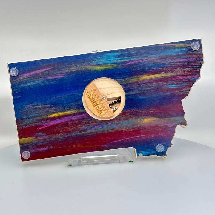 Knotty Pine Woodworks Handmade Montana Trout Cribbage Board Sunset (back)—this handmade wooden cribbage board is the perfect Montana-made gift for game lovers and fishers. The back features a compartment for storing metal pegs.