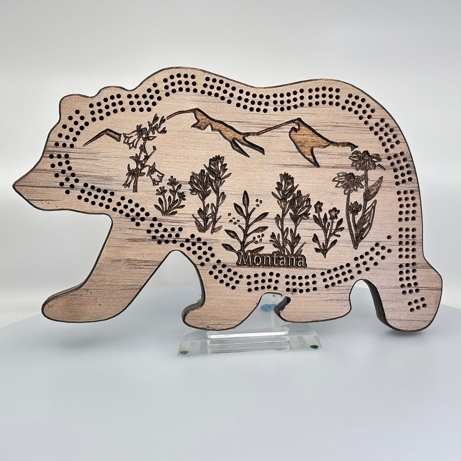 Knotty Pineworks Bear Handmade Cribbage Board with Montana Wildflowers (light wood with dark accents)—this handmade wooden cribbage board is the perfect Montana-made gift for game lovers and adventurers