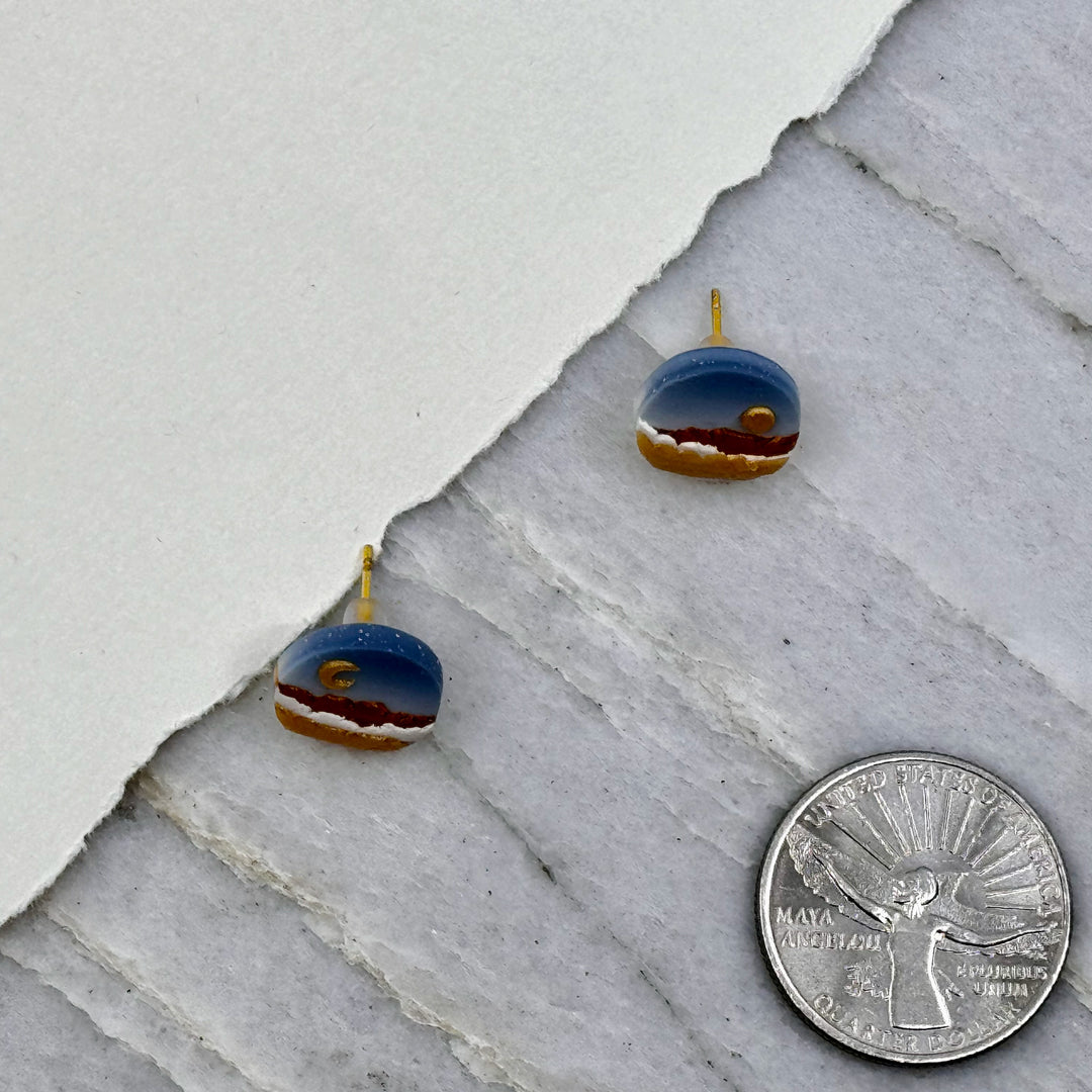 Pair of La Petite Rose's Sun Moon Landscape Clay Stud Earrings (blue and gold), with scale
