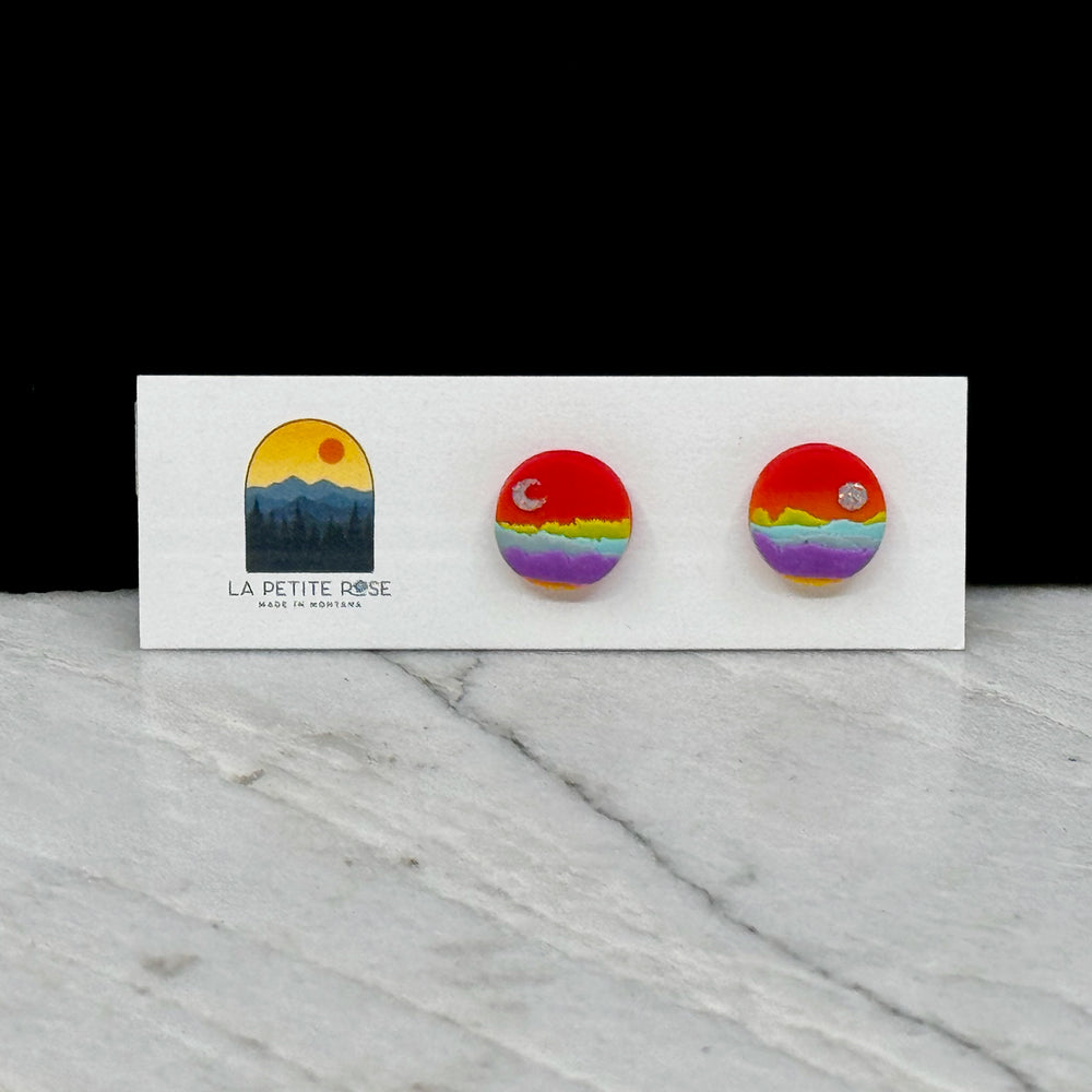 Sun Moon Landscape Clay Stud Earrings by La Petite Rose -  polymer clay stud earrings featuring a paired sun and moon over a colorful landscape (rainbow)