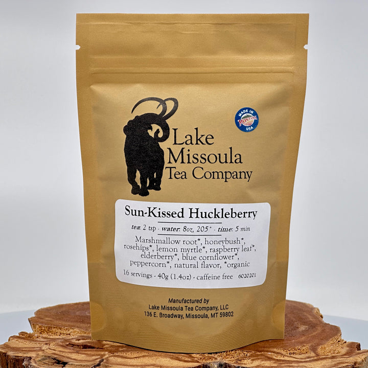 1.4 oz. bag of Lake Missoula Tea Co. Sun-Kissed Huckleberry Tea--the perfect gift of Montana tea; image depicts the front of the bag