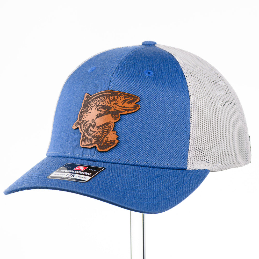 Etched Leather Fish Trucker Hat, featuring a real leather patch cut into the shape of a fish and etched with detail, securely attached to a blue and white trucker hat—handmade in Montana, USA by Last Best Supply Co.