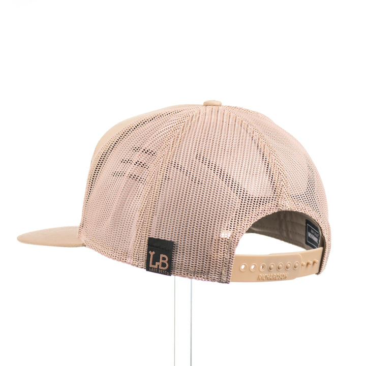 Flexwood Chinook Richardson Flat Bill Trucker Cap featuring a premium flexwood patch in the shape of a Chinook salmon, handmade in Montana, USA by Last Best Supply Co.