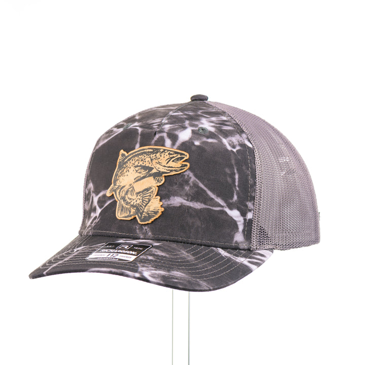 Flexwood Jumping Trout Richardson Trucker Cap featuring a premium flexwood patch in the shape of a jumping trout, handmade in Montana, USA by Last Best Supply Co.