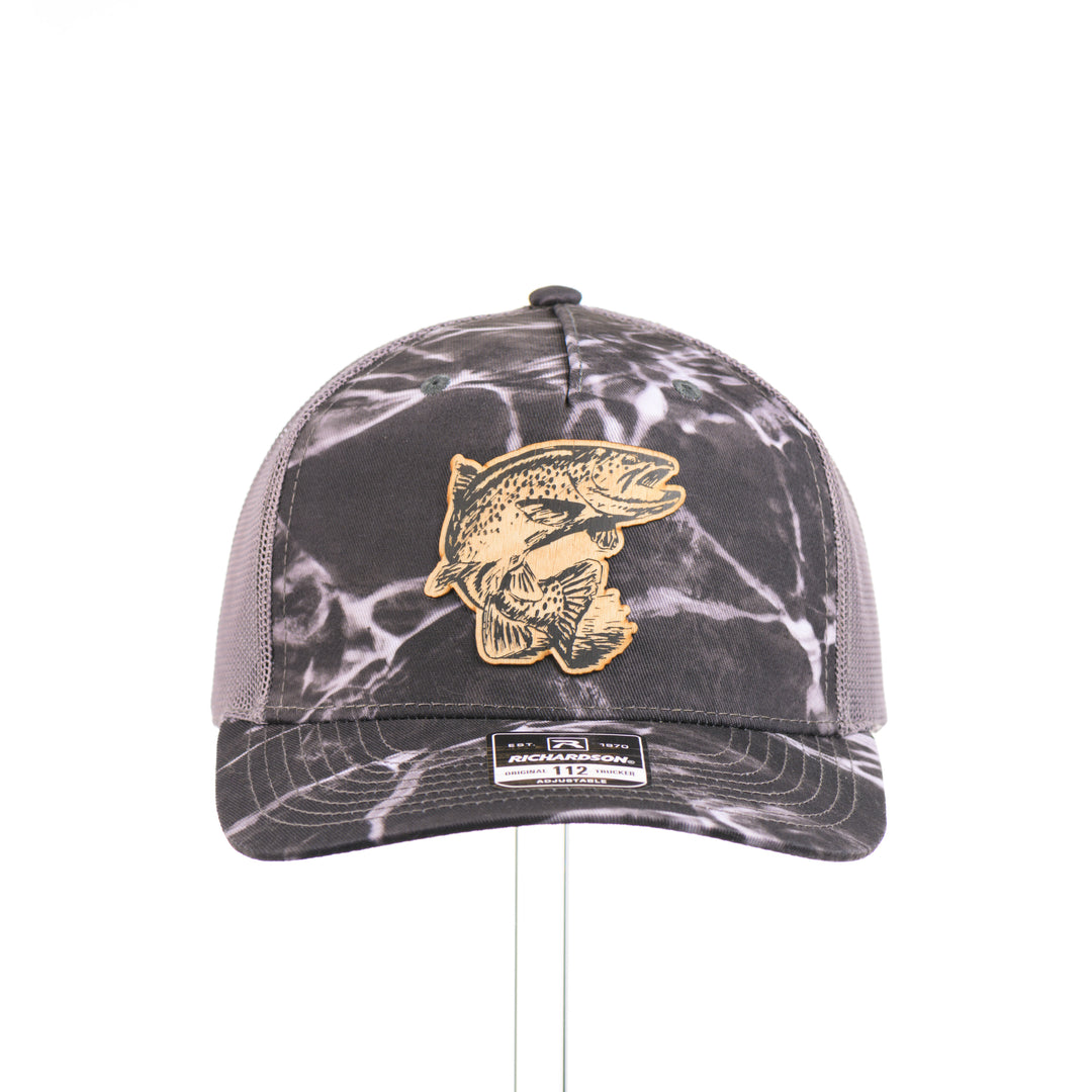 Flexwood Jumping Trout Richardson Trucker Cap featuring a premium flexwood patch in the shape of a jumping trout, handmade in Montana, USA by Last Best Supply Co.