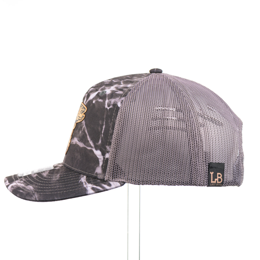 Flexwood Jumping Trout Richardson Trucker Cap featuring a premium flexwood patch in the shape of a jumping trout, handmade in Montana, USA by Last Best Supply Co.