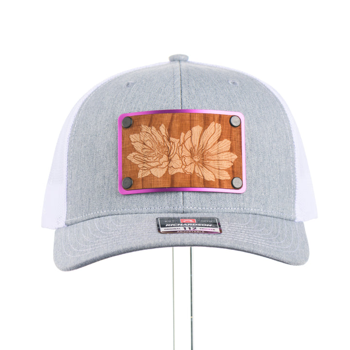 Heather Grey and white richardson hat with a Bitterroot wood and metal patch.