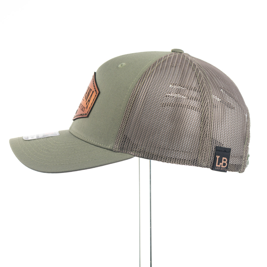 Green cap with mesh back and Montana The Last Best Place leather patch on a white background