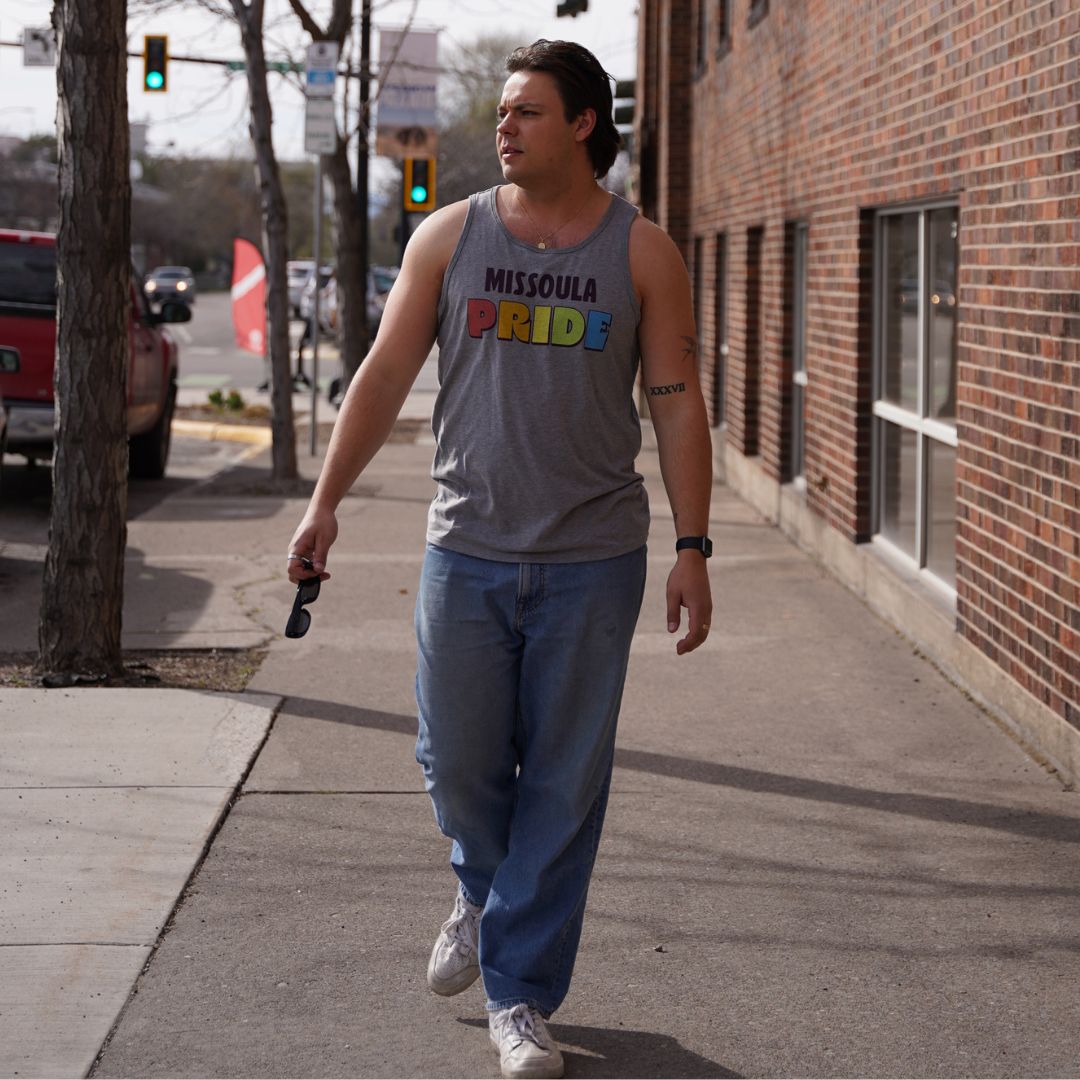 Grey all-gender / unisex tank top featuring the Missoula Pride logo made in Montana, USA; a portion of sales are donated to the Missoula Pride fundraiser.