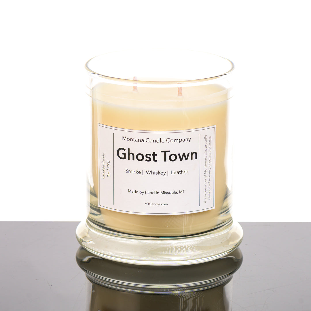 Ghost Town Candle soy blend candle handmade in Missoula, Montana by Montana Candle Company, with a blend of whiskey, leather, and smoke scents, in a 9 oz. glass tumbler