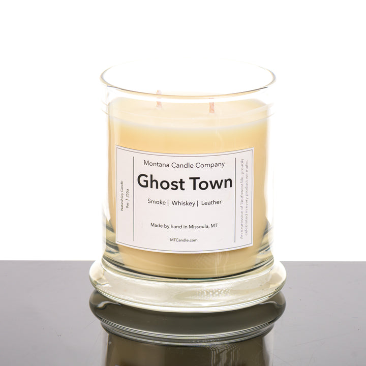 Ghost Town Candle soy blend candle handmade in Missoula, Montana by Montana Candle Company, with a blend of whiskey, leather, and smoke scents, in a 9 oz. glass tumbler