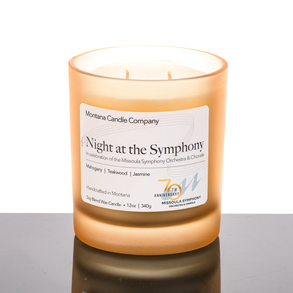 Night at the Symphony Candle (mahogany, teakwood, and jasmine scents) in a 12 oz. glass tumbler (champaign colored), made in Montana USA by Montana Candle Company