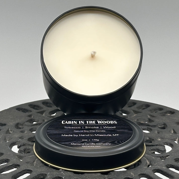 Cabin in the Woods Candle handmade in Missoula, Montana by Montana Candle Company, with a blend of tobacco, smoke, and wood scents, in a 6 oz. tin