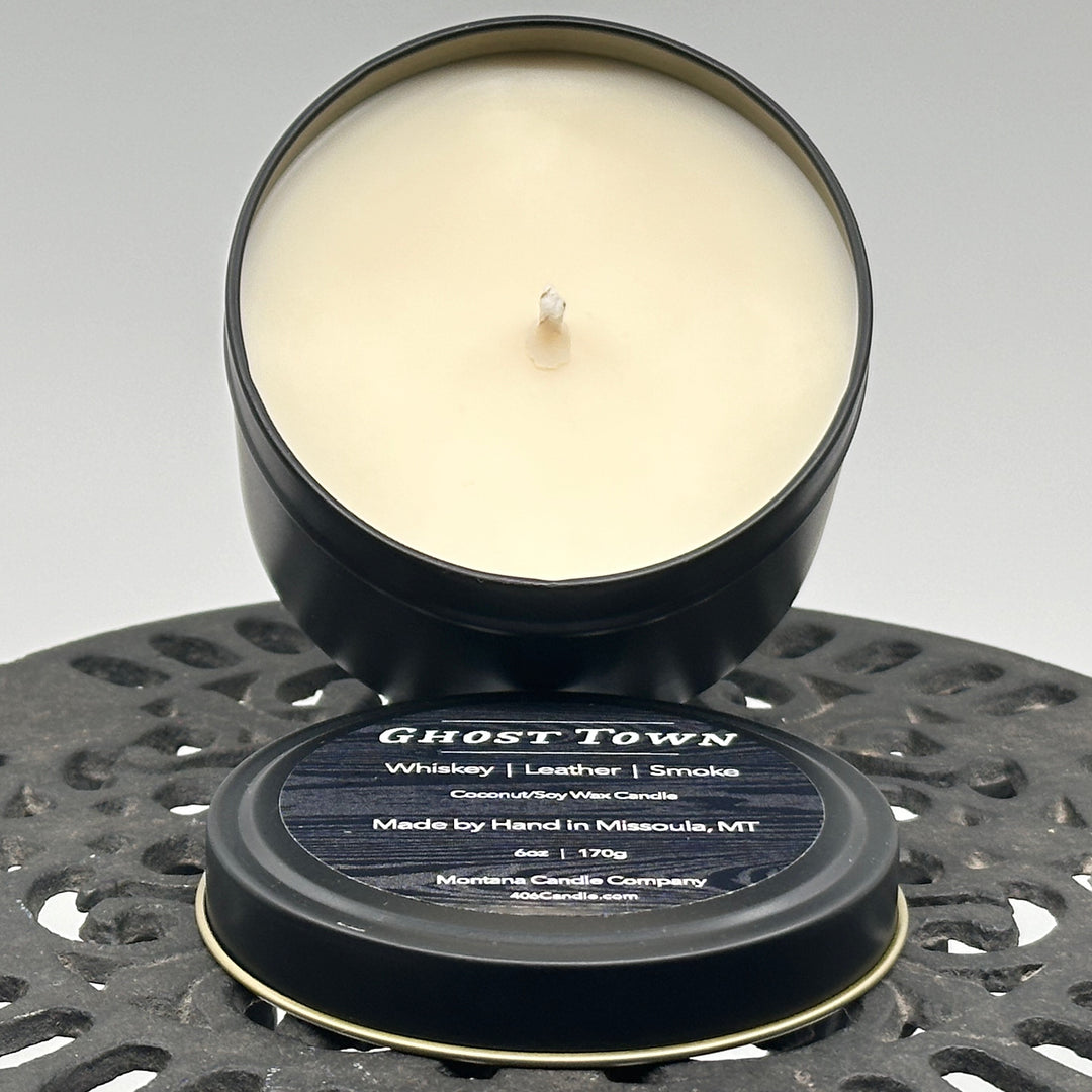 Ghost Town Candle soy blend candle handmade in Missoula, Montana by Montana Candle Company, with a blend of whiskey, leather, and smoke scents, in a 6 oz. tin