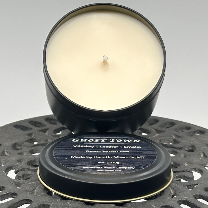 Ghost Town Candle soy blend candle handmade in Missoula, Montana by Montana Candle Company, with a blend of whiskey, leather, and smoke scents, in a 6 oz. tin