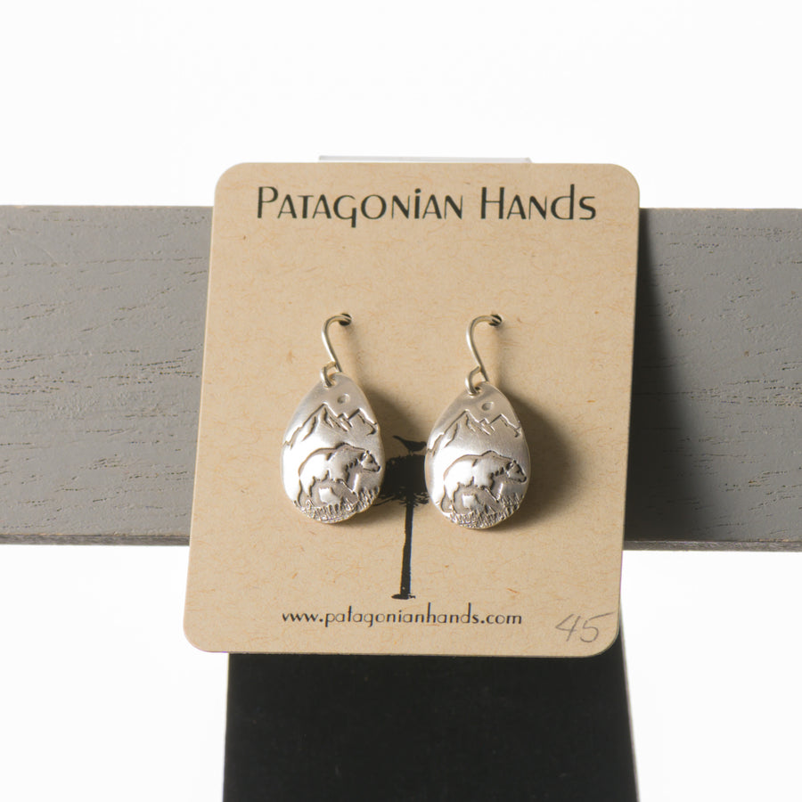 handmade teardrop earrings made of fine silver and stamped with bears and mountains.