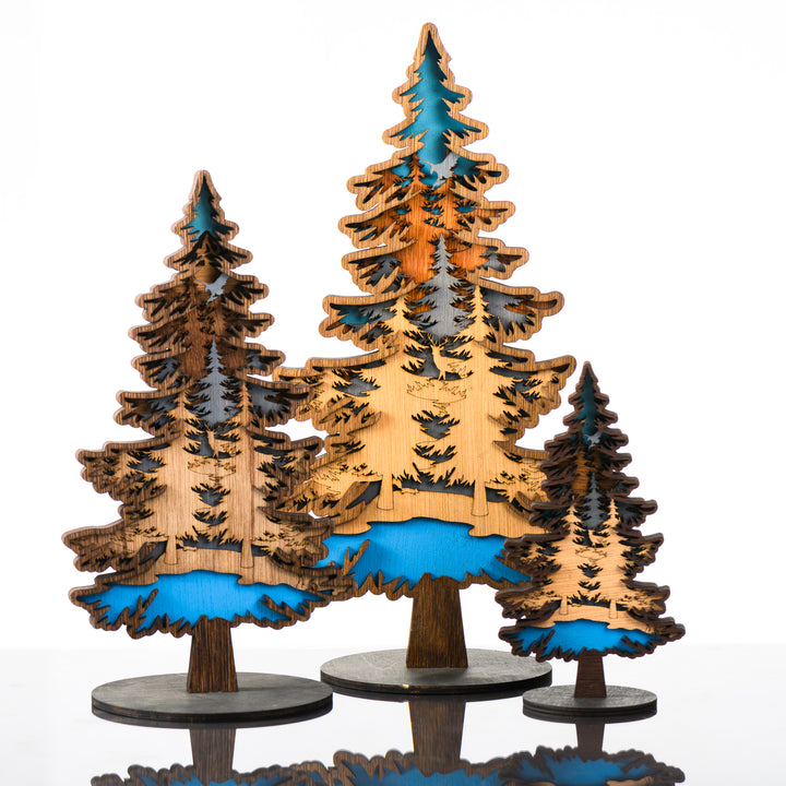 Tree 3D Layered Wood Art made in Montana by RJS Engraving & Design - laser-cut wood layers depict a forest and mountain within the silhouette of a tree, three sizes