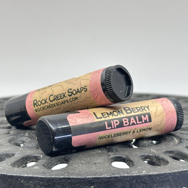 .15 oz. tube of Nourishing Natural Lip Balm, made in Montana by Rock Creek Soaps, available in assorted natural flavors - Lemon Berry (huckleberry & lemon)