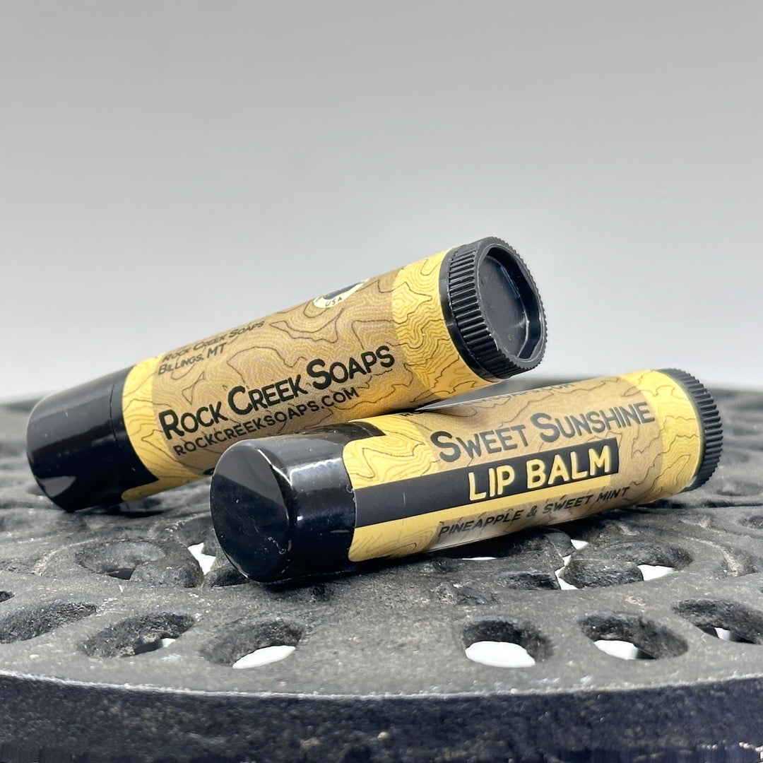 .15 oz. tube of Nourishing Natural Lip Balm, made in Montana by Rock Creek Soaps, available in assorted natural flavors - Sweet Sunshine (pineapple mint)