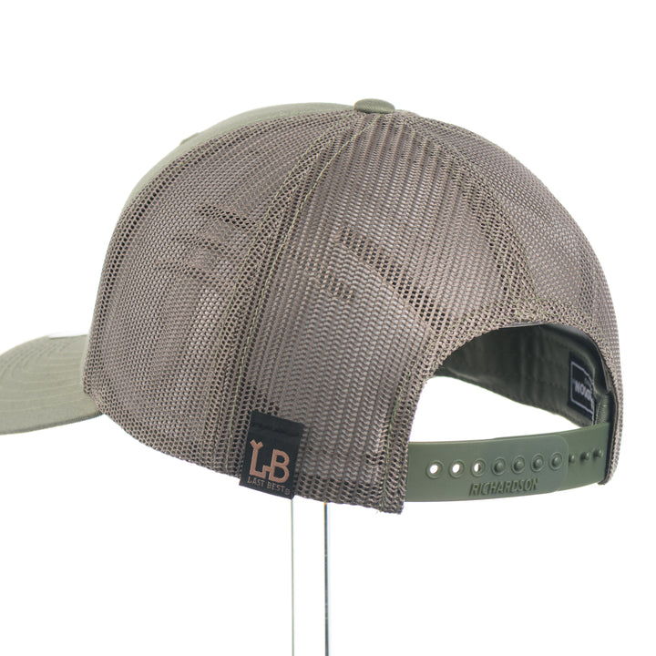 The back of a loden green Richardson 112 trucker hat
