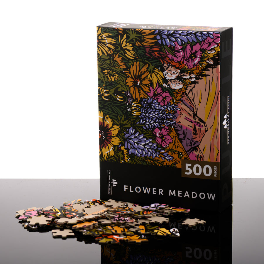 500-piece Flower Meadow puzzle, made in Montana by The Montana Scene; image depicts the box front with puzzle pieces.