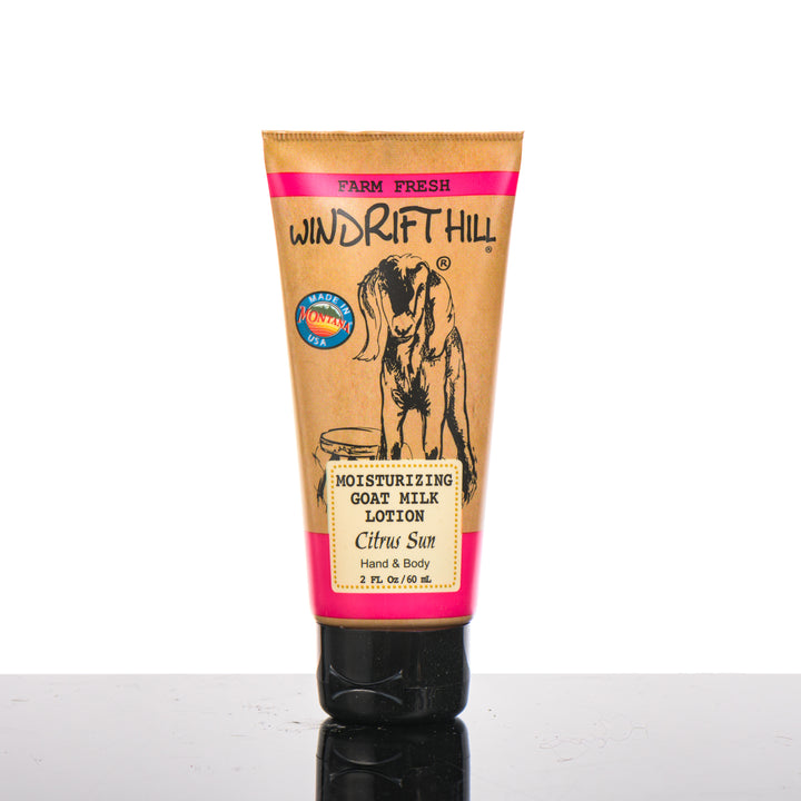 2 oz. bottle of Windrift Hill's Citrus Sun Goat Milk Lotion, goat’s milk body lotion handmade in Montana, USA