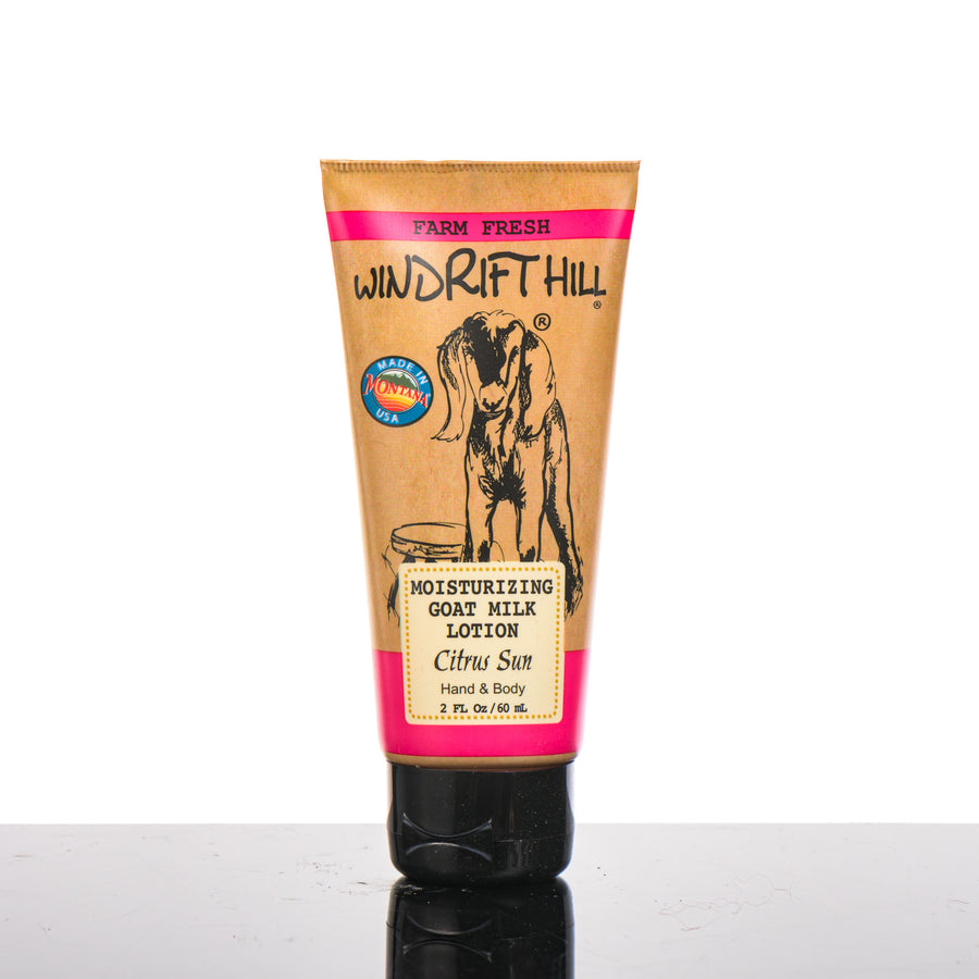 2 oz. bottle of Windrift Hill's Citrus Sun Goat Milk Lotion, goat’s milk body lotion handmade in Montana, USA