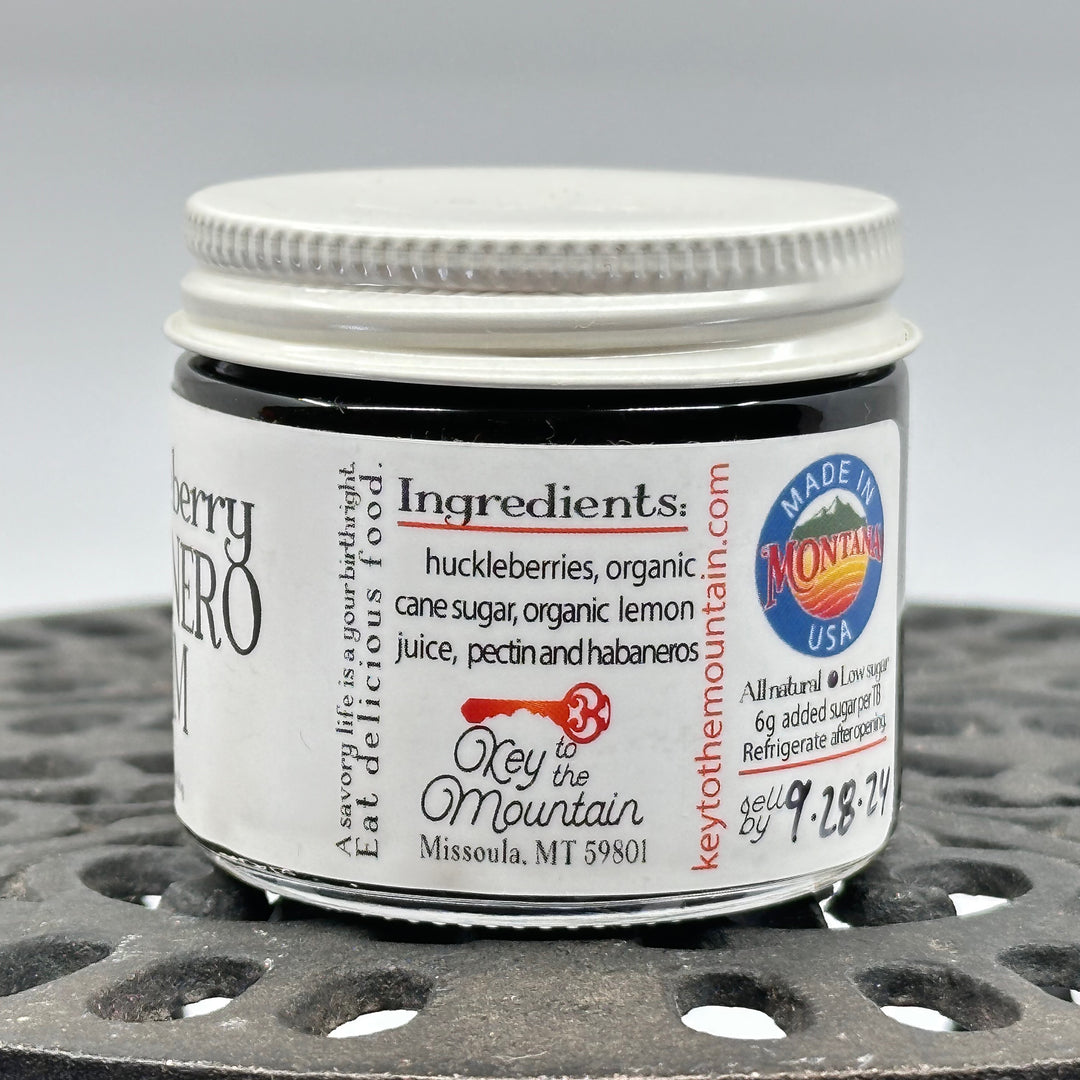 2 oz. jar of Key to the Mountain Huckleberry Habanero Jam, ingredients: huckleberries, organic cane sugar, organic lemon juice, pectin and habaneros