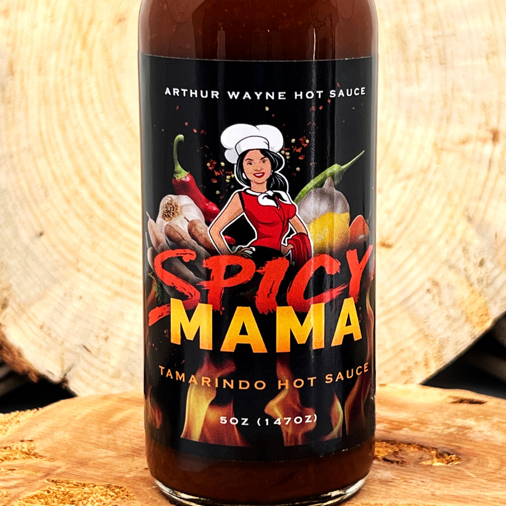 5 oz. bottle of Spicy Mama Hot Sauce, with Peppers (Habanero, Fresno), Tomato, Mango, Tamarind Concentrate, Cocoa, Lemon Juice, and spices made in Montana by Arthur Wayne Hot Sauce