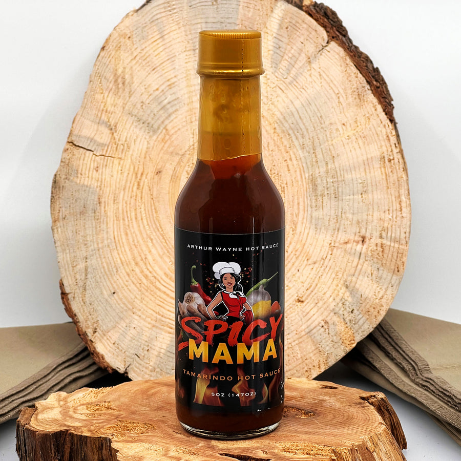 5 oz. bottle of Spicy Mama Hot Sauce, with Peppers (Habanero, Fresno), Tomato, Mango, Tamarind Concentrate, Cocoa, Lemon Juice, and spices made in Montana by Arthur Wayne Hot Sauce