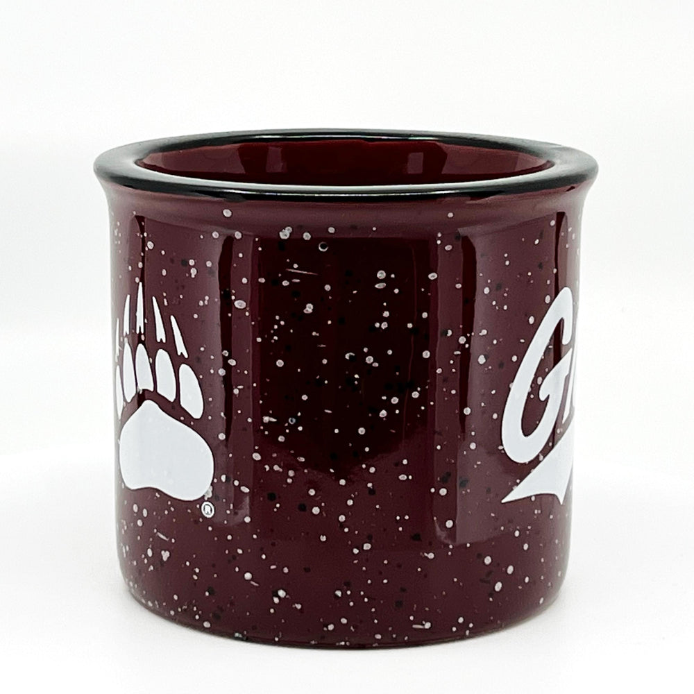 Blue Peaks Creative's Maroon Speckled Campfire Mug with the Griz script and paw designs in white, front