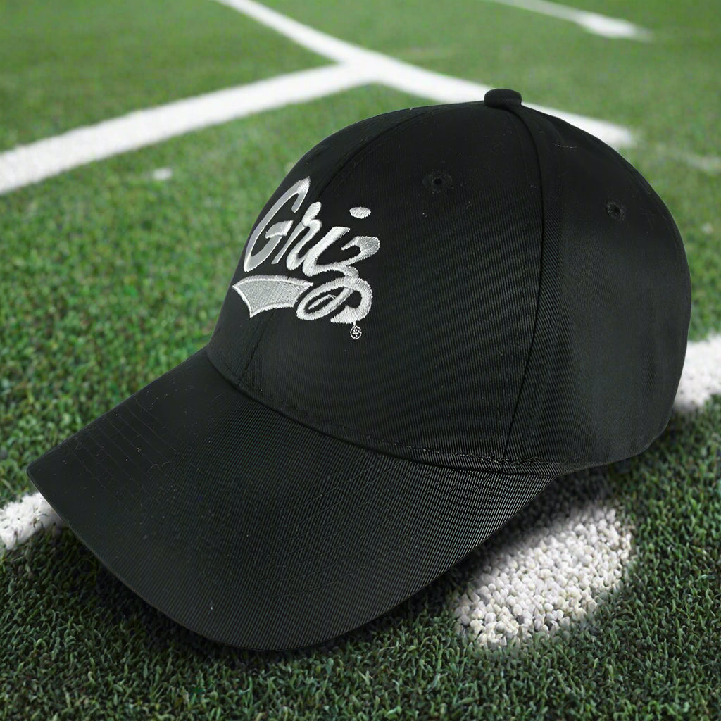 Black Griz Script - Six-panel Twill Hat made in Missoula, MT (home of the UM Grizzlies) by Blue Peak Creative—a black, six-panel twill baseball cap embroidered with the University of Montana Griz script in silver (3/4 view)