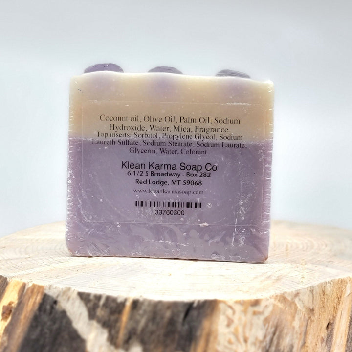 The back of a purple bar of Huckleberry soap.