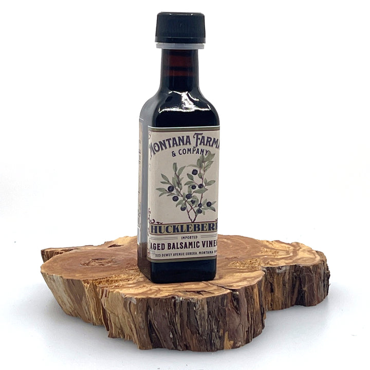 100 ml bottle of Montana Huckleberry Dark Aged Balsamic Vinegar, made in Montana by Montana Pharmacy